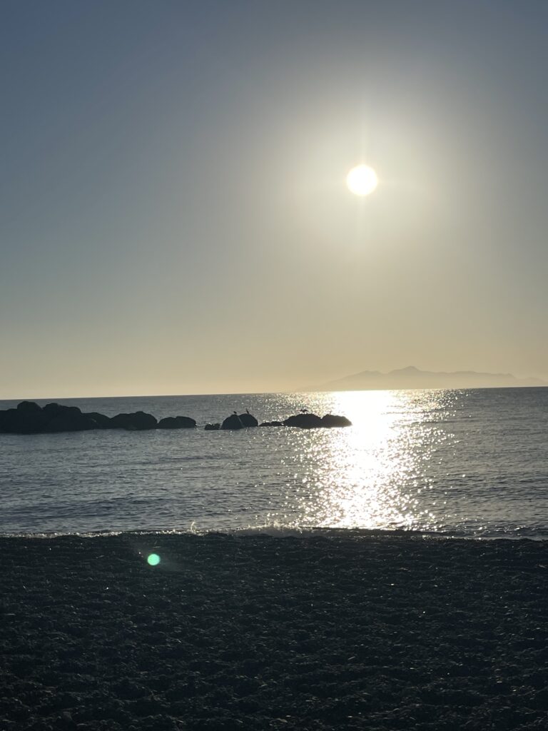 Santorini yoga retreat Kamari beach